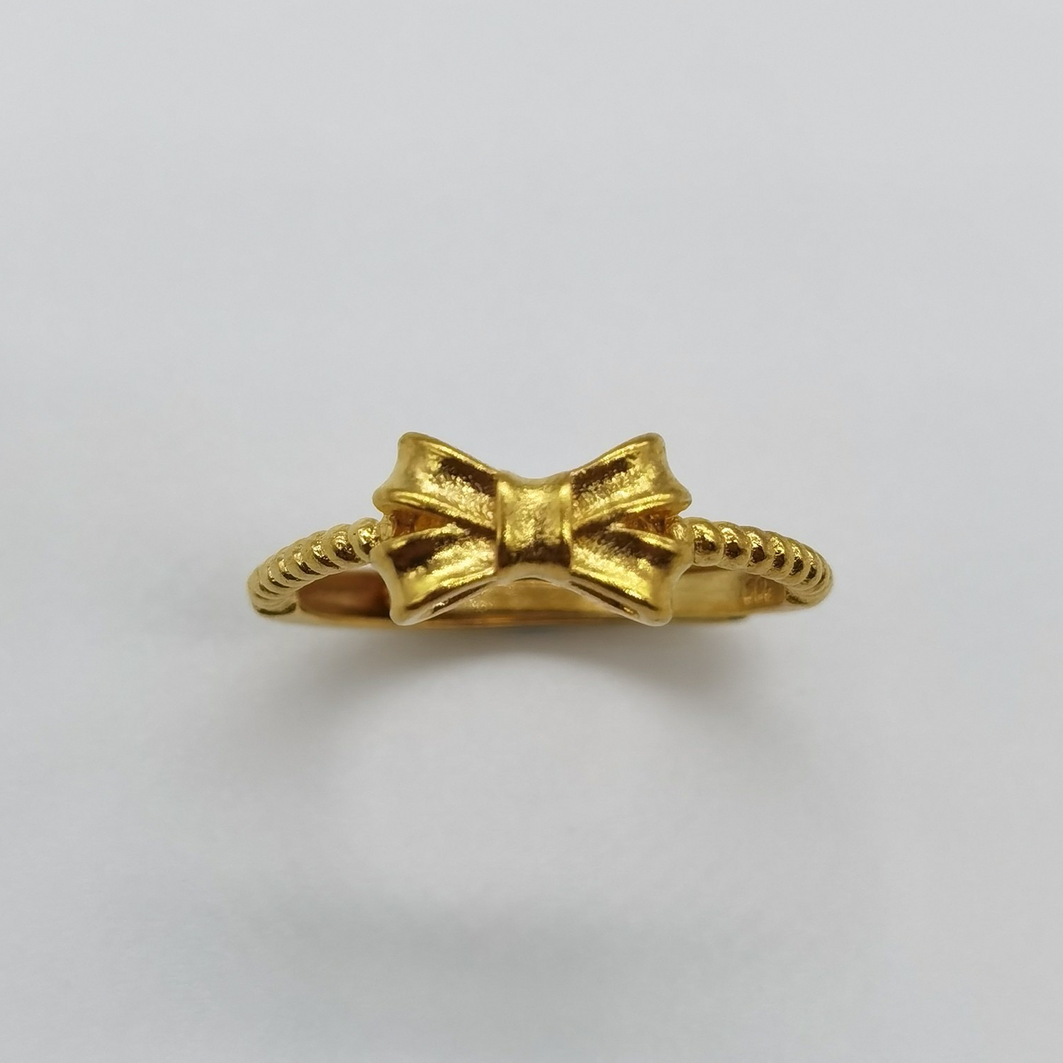 Alluvial gold vacuum electroplating 24K gold bow tie ring
