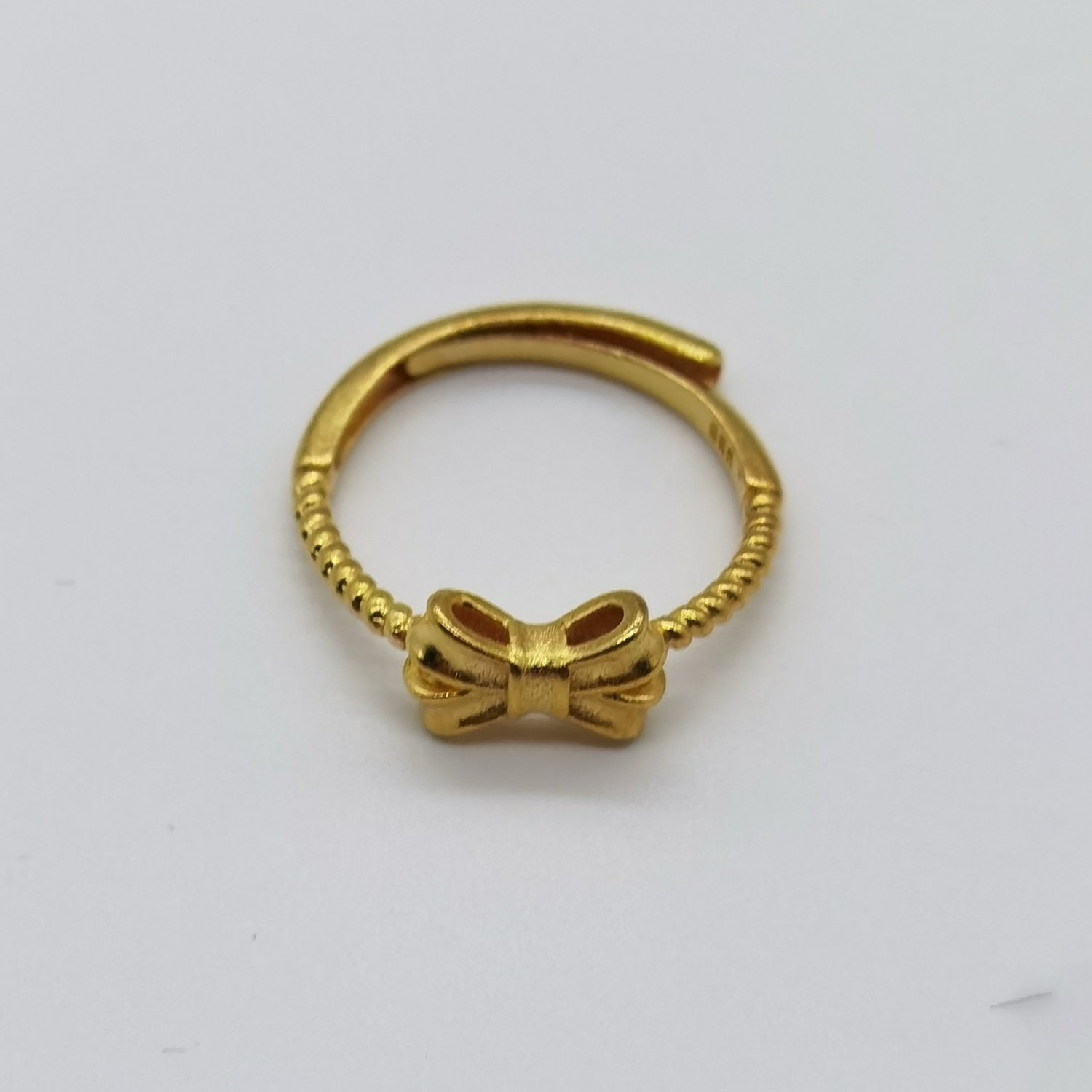 Alluvial gold vacuum electroplating 24K gold bow tie ring
