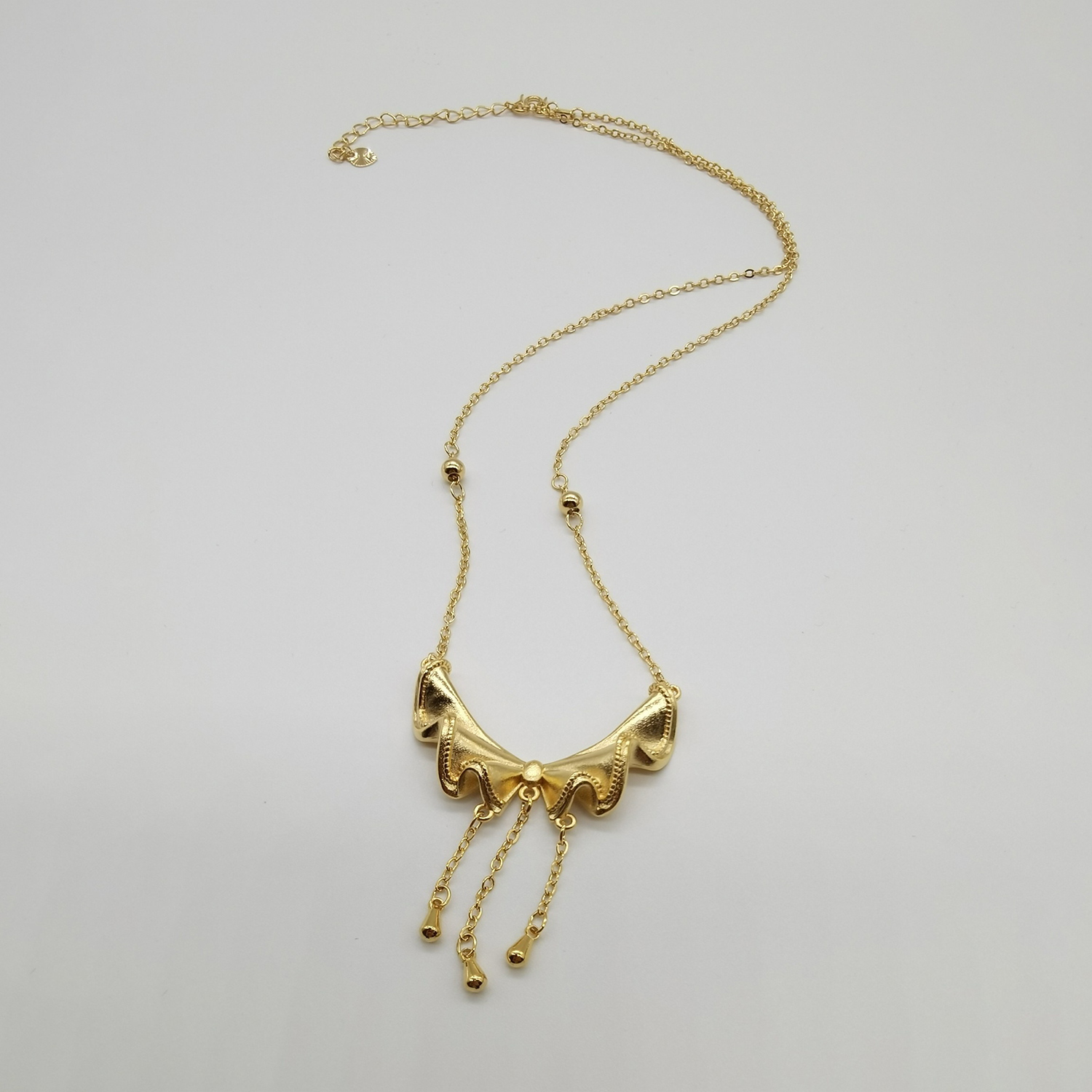 Alluvial gold vacuum electroplating 24K gold bow tassel necklace